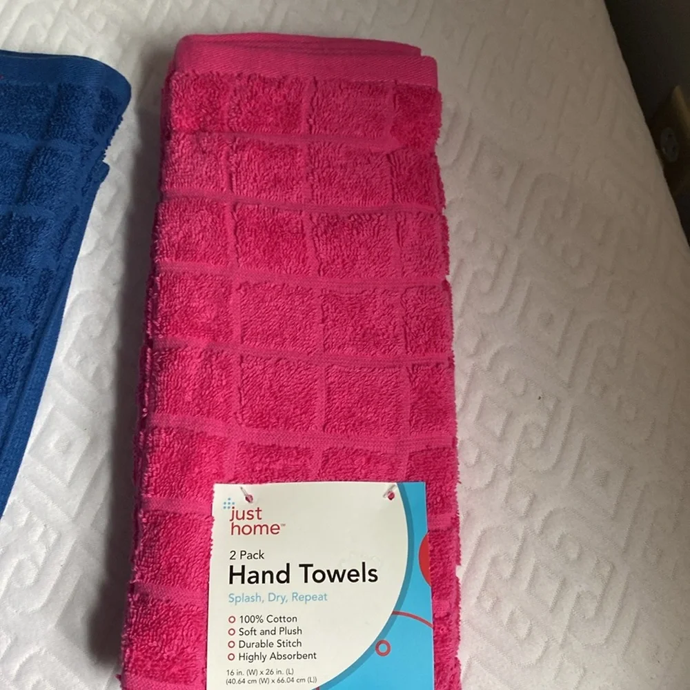 NWT two sets of 2 hand towels in navy and pink! 100% cotton! Smoke/pet FREE Home